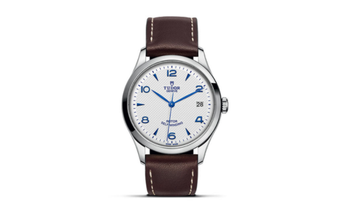 A sleek TUDOR 1926 watch with a brown leather strap, available at La Différence Time Centre.