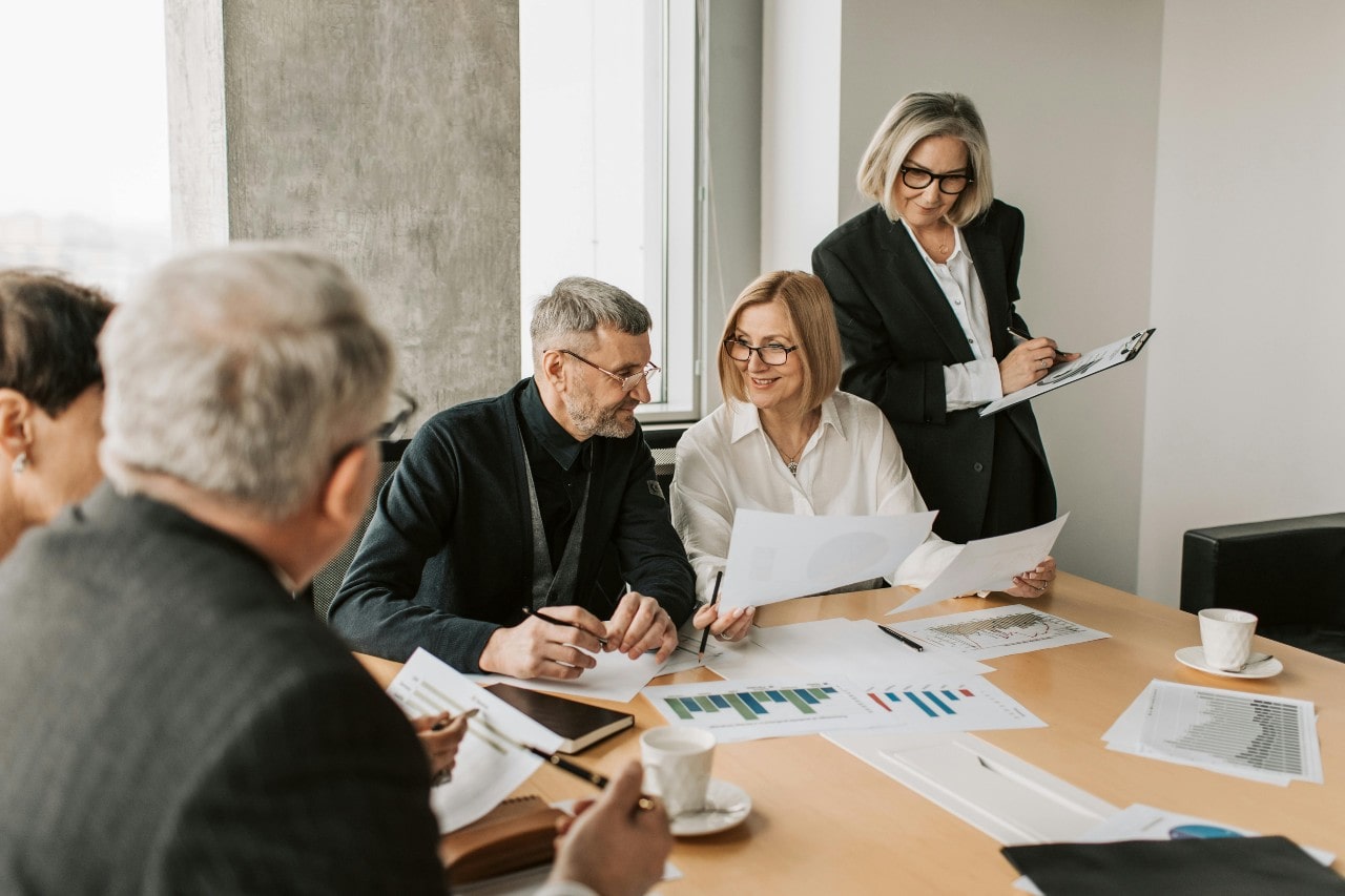 business people in corporate dress having a meeting in an office